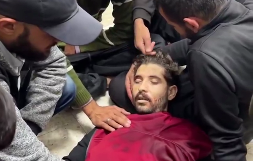 Thumbnail preview image for the video titled: Young man recites the Quran for friend killed while providing security to aid in Central Gaza