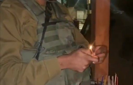 Thumbnail preview image for the video titled: Jewish soldiers celebrate Hanukkah by lighting candles during a raid in Jenin