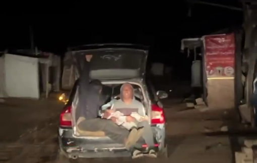 Thumbnail preview image for the video titled: Child rushed to hospital after Israeli airstrike on a tent in Al-Mawasi