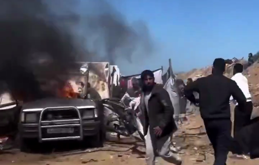 Thumbnail preview image for the video titled: Civilians rush to rescue victims following an Israeli airstrike on a car near tents