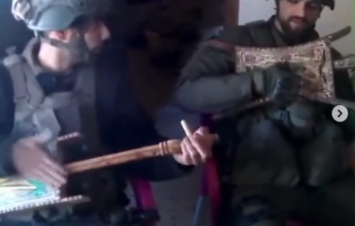 Thumbnail preview image for the video titled: Two Israeli soldier in Lebanon "play" a song with looted instruments