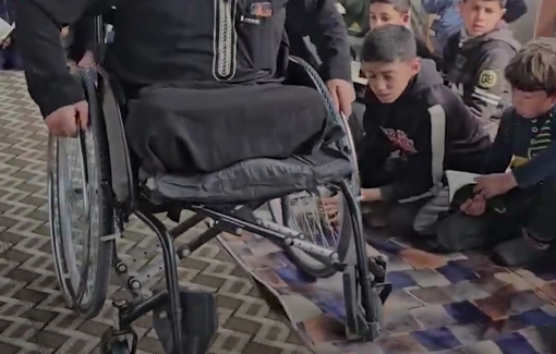 Thumbnail preview image for the video titled: Quran teacher persists in teaching full time despite losing his legs to Israeli bombing