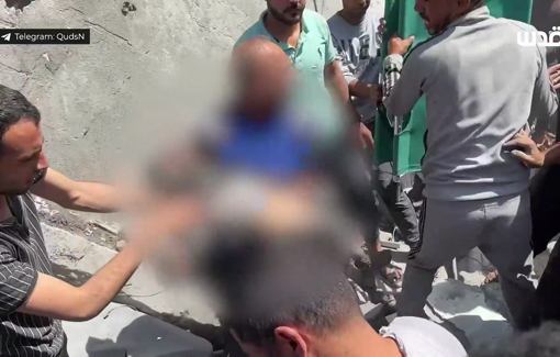 Thumbnail preview image for the video titled: Neighbors search for victims following the Israeli bombing of the Abu Sahloul family house