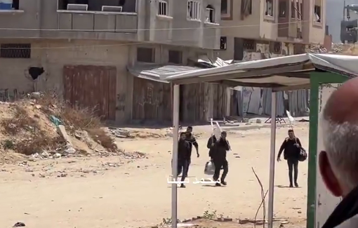 Thumbnail preview image for the video titled: Displaced Palestinians carrying white flags head to hospital for shelter