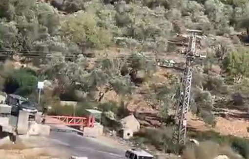 Thumbnail preview image for the video titled: In Qarawat Bani Hassan, a video shows Palestinian people running amid audible gunfire