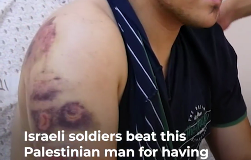 Thumbnail preview image for the video titled: Israeli soldiers at a military checkpoint in Hebron brutally beat up a Palestinian man for having a picture of Gaza on his mobile phone.