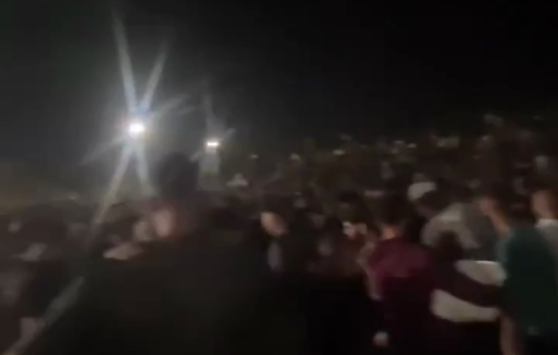 Thumbnail preview image for the video titled: Amid chaotic GHF aid distribution, Palestinians scavenge between ripped apart cartons and scattered bags