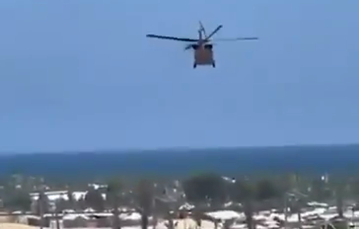 Thumbnail preview image for the video titled: Israeli helicopter flies very low over displacement tents