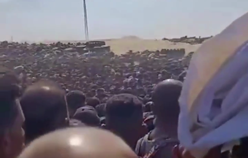 Thumbnail preview image for the video titled: Live footage of aid seekers being shot while taking cover at a GHF site