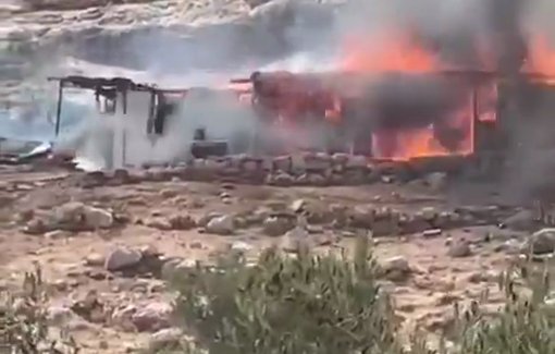 Thumbnail preview image for the video titled: Settlers backed by soldiers set fire to the homes of the Ein Ayoub Bedouin community to expel them