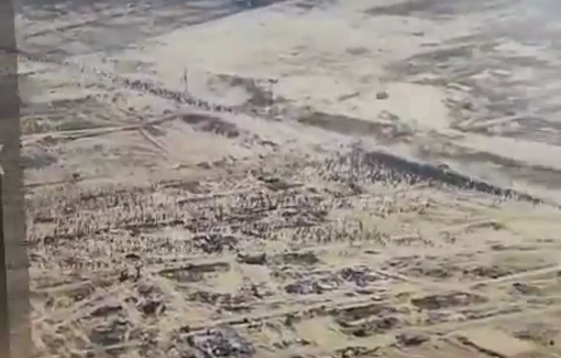 Thumbnail preview image for the video titled: IDF soldier's footage of thousands of "walking dead" heading to a GHF site