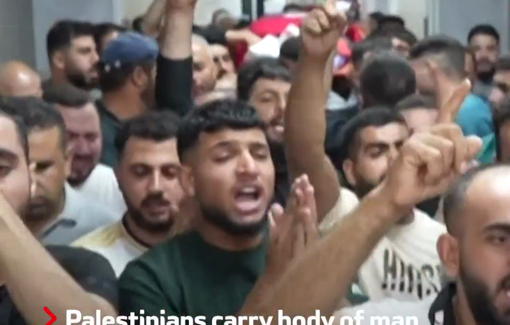 Thumbnail preview image for the video titled: Palestinians chant slogans as they carry the body of 18-year-old Hamdan Abu Aliya murdered by Israeli soldiers