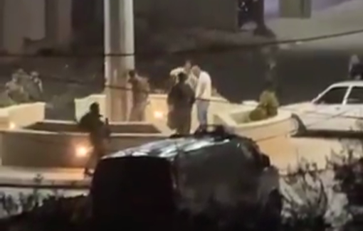 Thumbnail preview image for the video titled: Israeli soldiers attempting to take down a Palestinian flag in the main roundabout in Aqraba