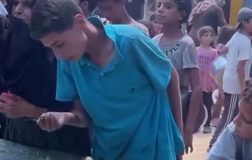 Thumbnail preview image for the video titled: Boy eats from leftover rice at a charity ktichen