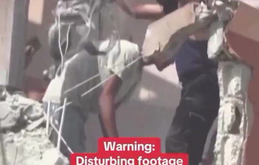 Thumbnail preview image for the video titled: Civilian Abdullah Amer holds out Hussam Al-Masri's camera and vest after the first strike