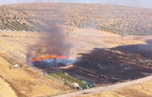 Thumbnail preview image for the video titled: Israelis settlers set fire to a large farming area in Al-Mughayir