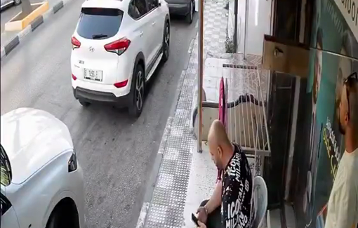 Thumbnail preview image for the video titled: Israeli soldiers assaulted a Palestinian sitting in front of his shop in Dura, after he refused to close it