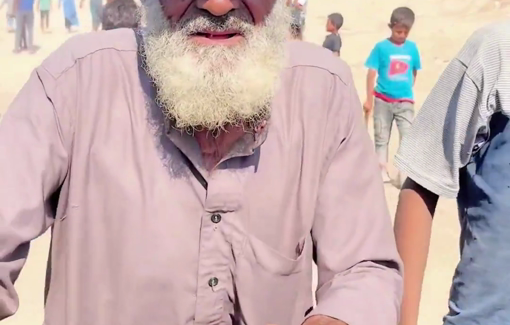 Thumbnail preview image for the video titled: Elderly Palestinian pushes a bicycle while being displaced on an empty stomach