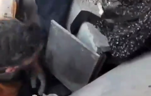 Thumbnail preview image for the video titled: Civil Defense crews comfort a woman while pulling her out of the rubble of her home bombed by Israel