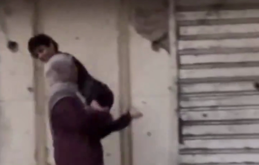 Thumbnail preview image for the video titled: Palestinian mother carries her child with special needs while fleeing Al-Rimal neighborhood