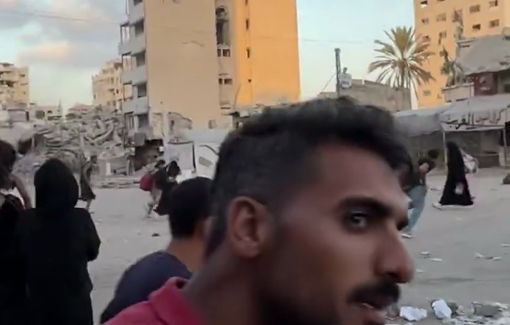 Thumbnail preview image for the video titled: Civilians hurry to cross the street after Israeli drones opened fire at the Al-Saraya inetrsection in Gaza City