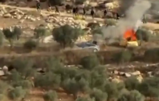 Thumbnail preview image for the video titled: Dozens of settlers assaulted Palestinians during the olive harvest in Turmus Ayya, and set fire their two vehicles