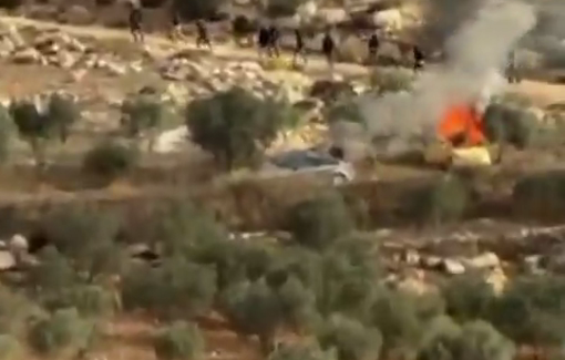 Thumbnail preview image for the video titled: Israeli settler militias torch two vehicles in attack on olive harvesters in Turmus Ayya