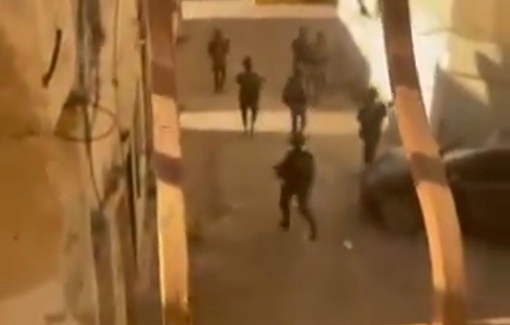 Thumbnail preview image for the video titled: Israeli forces tear up photos of slain Palestinians killed perviously by Israeli gunfire during their raid on Al-Fara’a