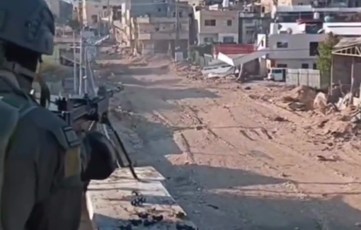 Thumbnail preview image for the video titled: Israeli soldier celebrating Christmas by fring on residential building in Tulkarm