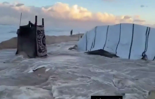 Thumbnail preview image for the video titled: Tents collapsed under advancing waves as families scramble to protect children and salvage what they can