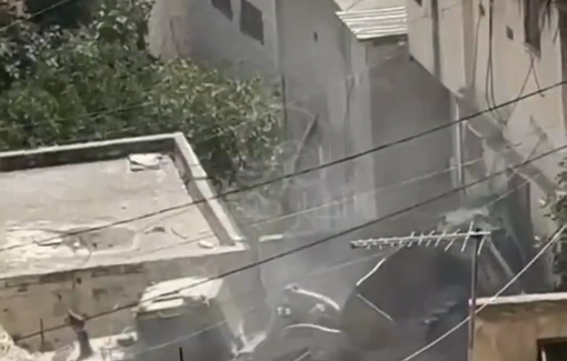 Thumbnail preview image for the video titled: After execution of two Palestinians, the Israeli bulldozer demolishes the houses surrounding the besieged house